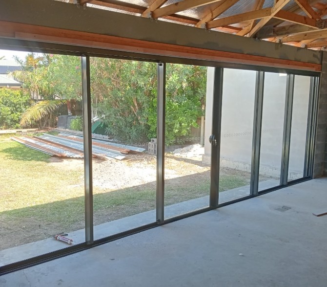 Sliding stacking glass door installation Mackay